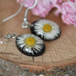 Black oval daisy earrings