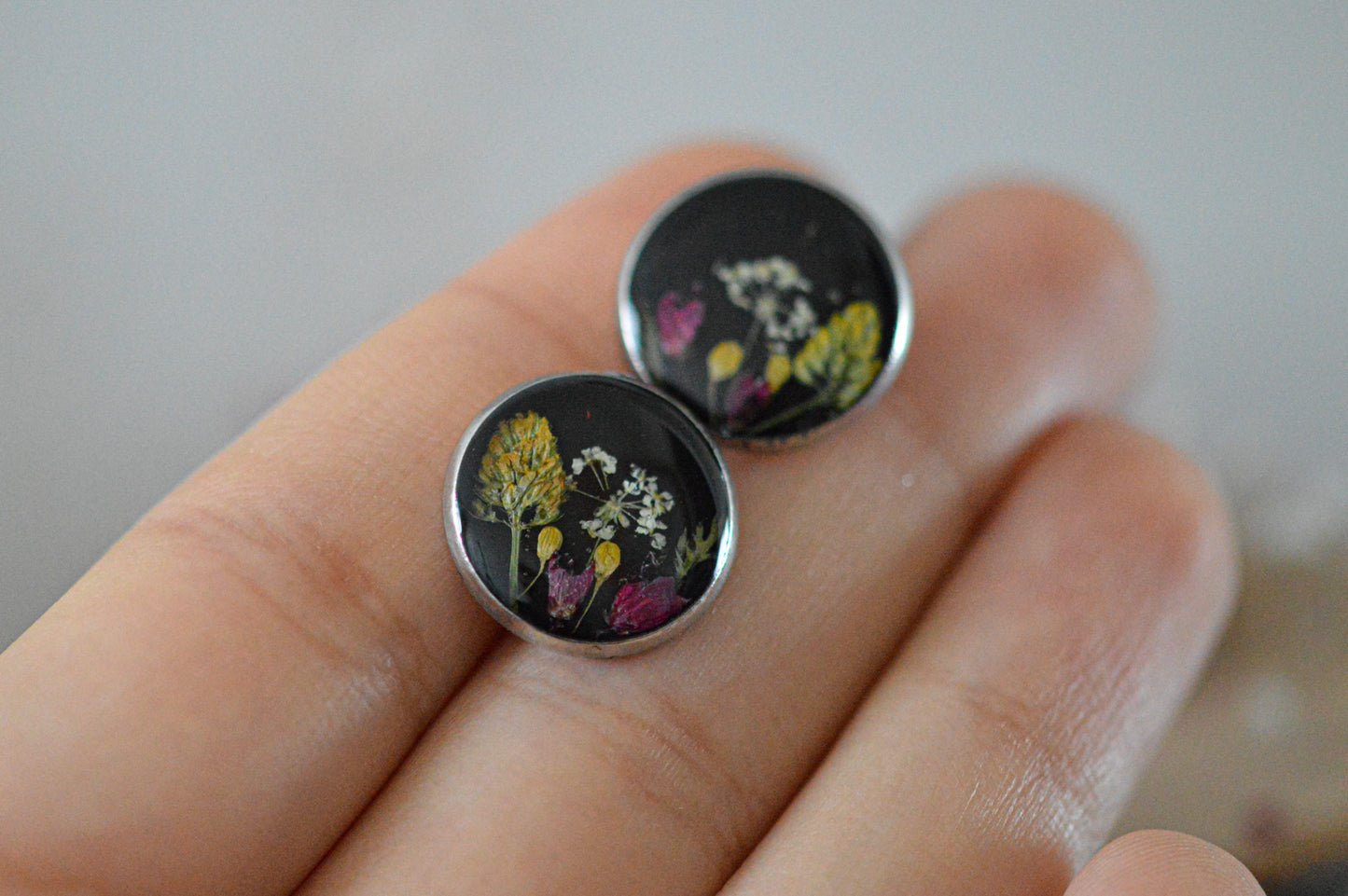 Black floral stud earrings