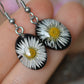 Black oval daisy earrings